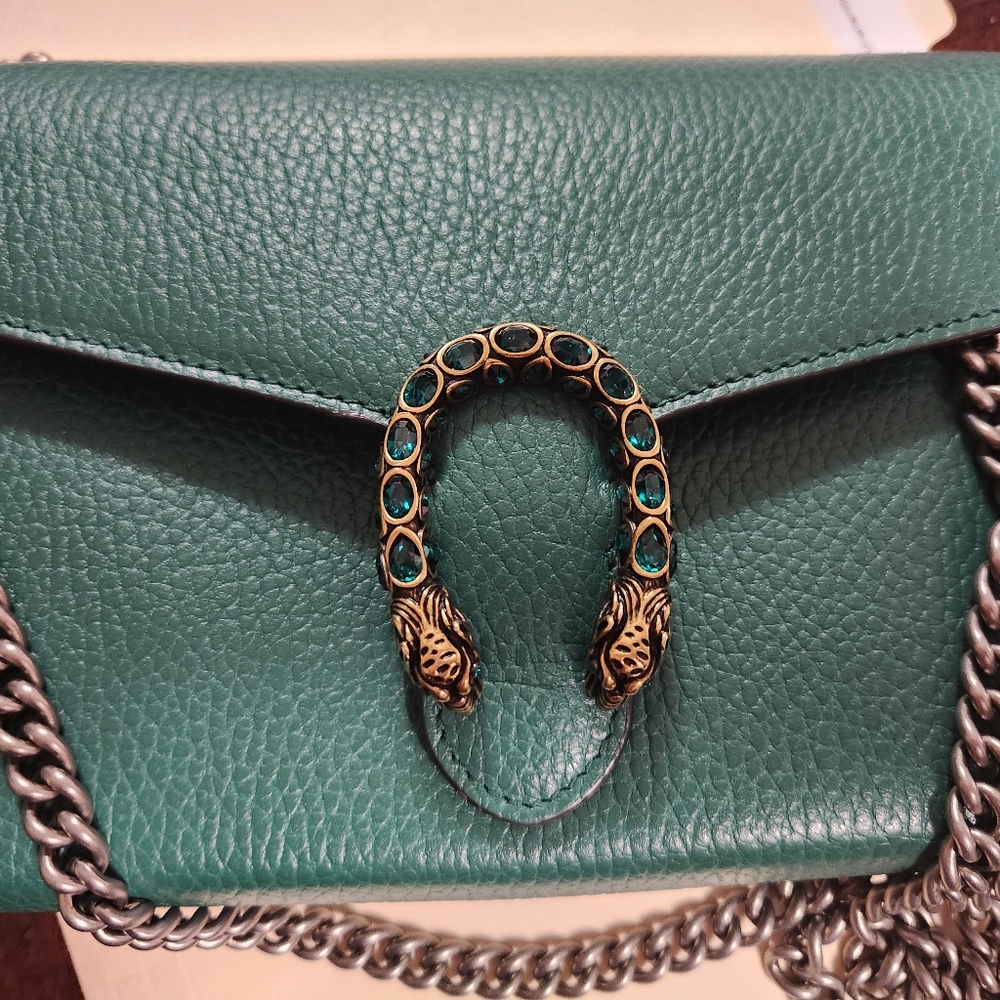 cross body bag you use as clutch or shoulder bag.